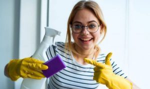 young woman wearing specs ready to spruce up her house