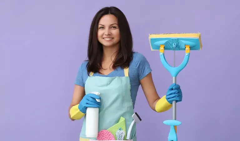 young woman with some cleaning essentials