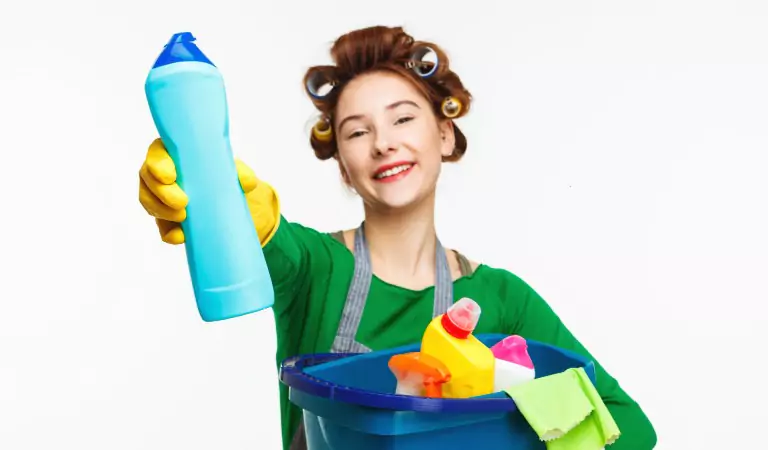 young woman with some cleaning supplies ready for cleaning