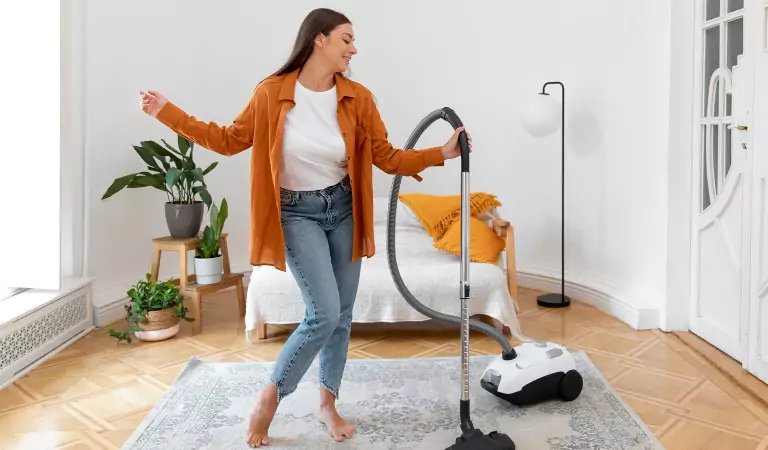 young woman is ready to steam clean her carpets