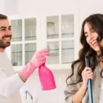 couple inside of a house looking ready to clean