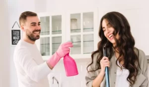 couple inside of a house looking ready to clean
