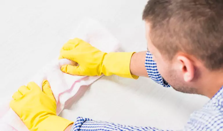 young man cleaning the floor