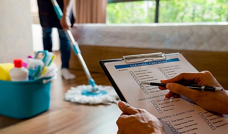 cropped-hand-person-holding-paper-clipboard-home