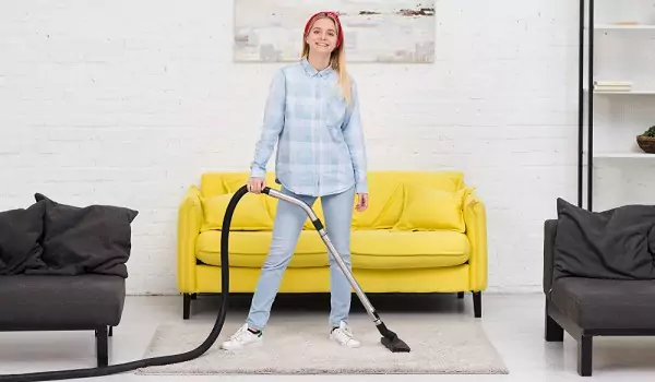 woman with a vacuum cleaner