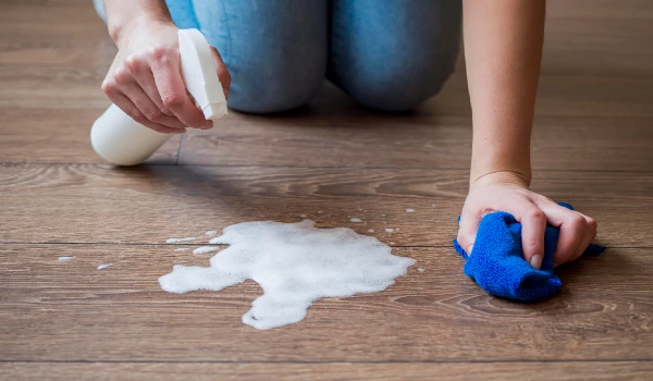 Close-up disinfecting the floor with chemicals
