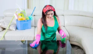 Beautiful asian woman wiping and cleaning a table